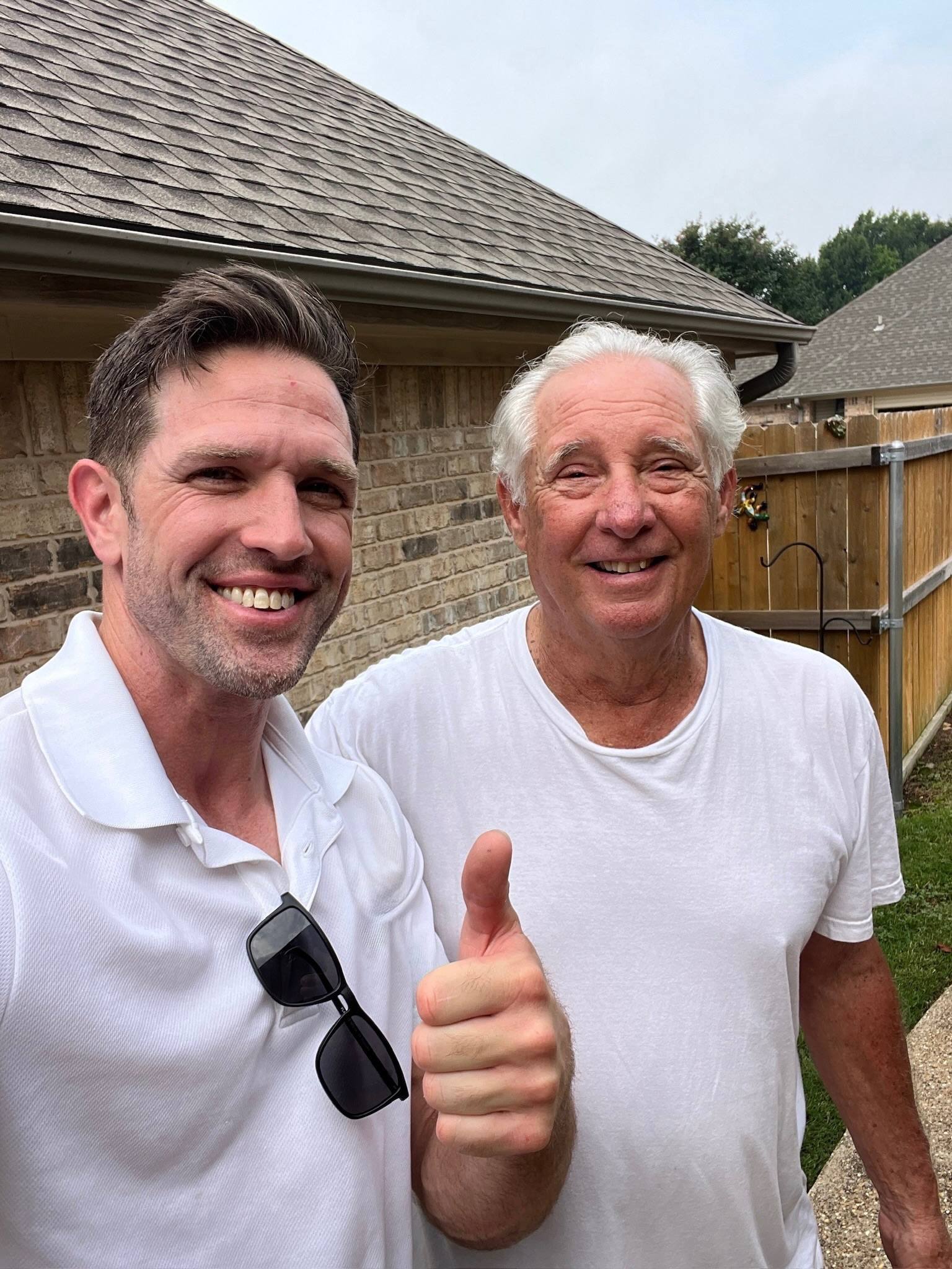 Daniel speaking with a homeowner